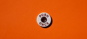 "Push once" button on orange background